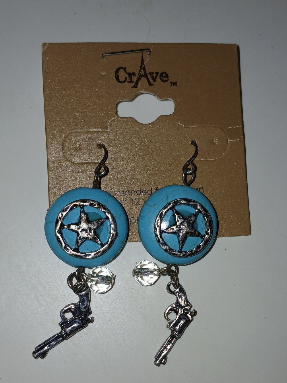 Crave Turquoise Star & Revolver Dangle Earrings. Costume